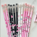 Set of slim My Melody gel pens in pink, black, and white barrels decorated with character art, bow patterns, and clear friction-eraser caps