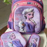 Lavender and bright pink 3-piece Frozen set featuring a school backpack, insulated lunch tote, and zip pencil case with 3D graphics of Elsa and Olaf