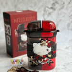 A dual-compartment water bottle with a split translucent ruby-red and smoky charcoal-grey body, wrapped in a black quilted silicone band with a 3D Hello Kitty in a red, black, and gold gothic-lolita dress holding a star-tipped wand, shown with matching independent pop-up lids and a character shoulder strap