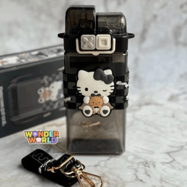 A square-shaped dual-compartment water bottle in translucent smoky charcoal black, wrapped in a black-and-grey checkered silicone sleeve with a 3D winking Hello Kitty wearing a black bow and holding a tiny brown teddy bear, secured by a cream-colored clasp with dark grey "XO" push buttons
