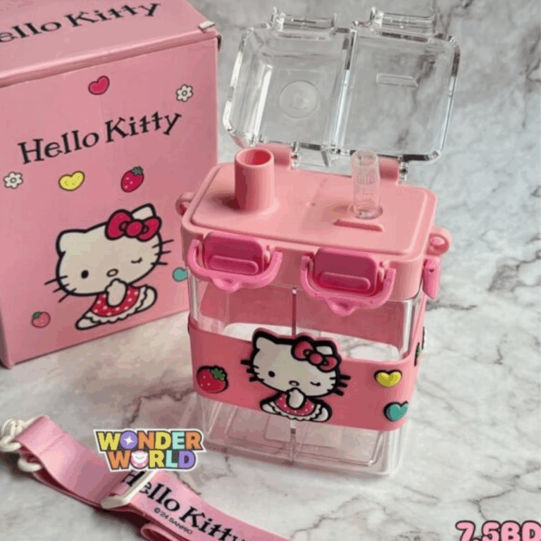A modern square-shaped clear drink bottle with split dual chambers, topped by a pastel pink cap with two deep pink click-locks under a rectangular clear flip-cover, featuring a matching pink protective silicone sleeve with a 3D winking Hello Kitty in a red polka-dot dress next to raised strawberries and hearts