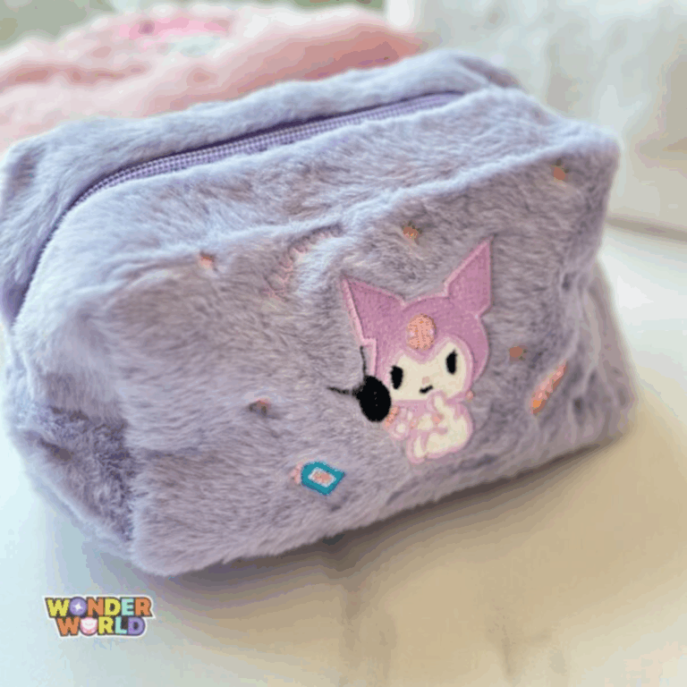 A close-up shot of a soft, fuzzy pastel lavender plush makeup pouch featuring an embroidered graphic of Kuromi holding a makeup puff/brush surrounded by small embroidered stars and beauty bottles under a matching purple zipper