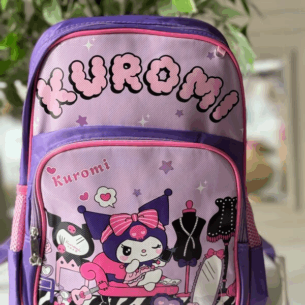 Purple and pink Kuromi backpack featuring bold bubbly lettering and a front print of Kuromi in a fashion boutique salon