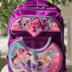 Vibrant magenta and purple My Little Pony backpack with 3D graphic panels featuring Twilight Sparkle, Rainbow Dash, Pinkie Pie, Spike, and friends