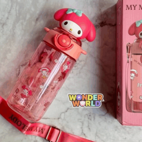 A translucent pink water bottle printed with various cute My Melody graphic motifs, featuring a unique 3D sculpted lid shaped like My Melody's head with a pastel mint-green bow, shown next to its pink packaging and matching adjustable shoulder strap with gold-toned clips