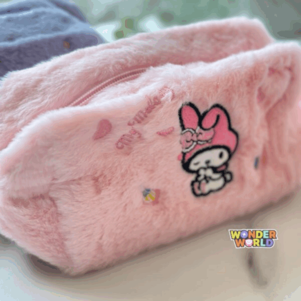 A close-up shot of a soft, fuzzy pastel pink plush vanity pouch, showcasing a detailed embroidery of a winking My Melody, floating pink petals, a tiny sweet treat, and cursive "My Melody" branding beneath a matching pink zipper