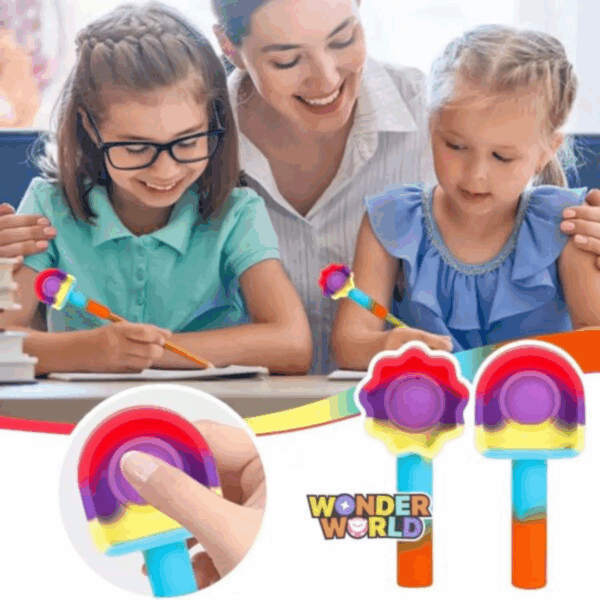 A close-up display of two whimsical silicone pencil toppers shown in a collaborative learning setting, one shaped like a blossoming flower and the other like a smooth dome arch, featuring a vibrant rainbow gradient of crimson red, royal purple, sunny yellow, and sky blue