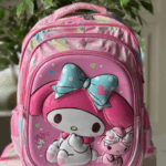 Bright pink and pastel tie-dye backpack featuring an embossed 3D My Melody wearing a aqua polka-dot bow alongside a matching plush kitten