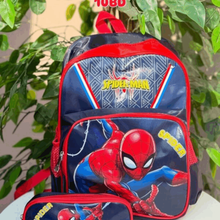 A premium school backpack and matching zippered utility case in deep midnight navy blue and athletic crimson red, showcasing a graphic geometric spiderweb pattern on the upper panel and a dynamic action-pose of Spider-Man on the lower front pocket