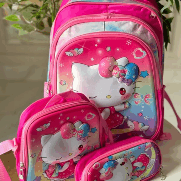 Bright pink Hello Kitty 3-piece set featuring a school backpack, insulated lunch tote, and zip pencil pouch with 3D winking Hello Kitty graphics over a rainbow background