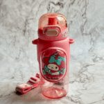 Clear pink-tinted water bottle with a matte pink silicone sleeve featuring a winking My Melody graphic, paired with a matching pink shoulder strap