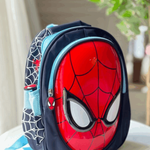 Dark navy blue backpack featuring a glossy high-relief 3D Spider-Man mask shell and white spiderweb print along the side panels