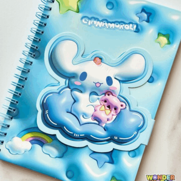 A close-up layout of a light blue spiral notebook featuring a puffy 3D-effect cover with Cinnamoroll holding a purple teddy bear while floating on a dark blue cloud, accented by a rainbow and stars