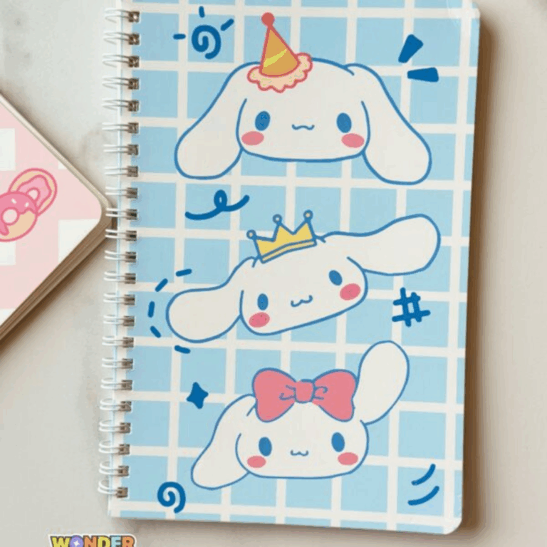 A light blue grid-patterned spiral notebook featuring three cute illustrations of Cinnamoroll stacked vertically, each wearing a different accessory: a party hat, a golden crown, and a pink bow
