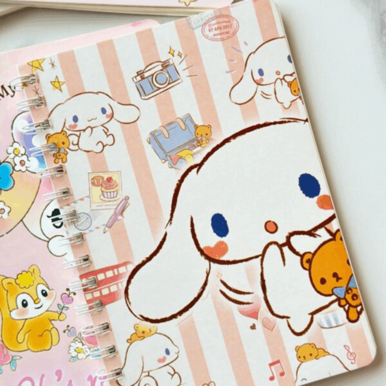 A wire-bound notebook featuring a warm peach and cream vertical striped background with various sketched illustrations of Cinnamoroll, a travel suitcase, a retro camera, a red double-decker bus, and a little brown teddy bear