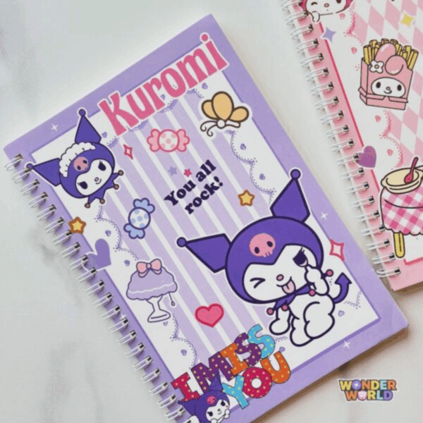 A lavender spiral notebook featuring a center panel of light purple and white vertical stripes. It shows a playful Kuromi winking and sticking her tongue out, surrounded by candies, a dessert stand, and the phrases "You all rock!" and a colorful, patterned "I MISS YOU" at the bottom