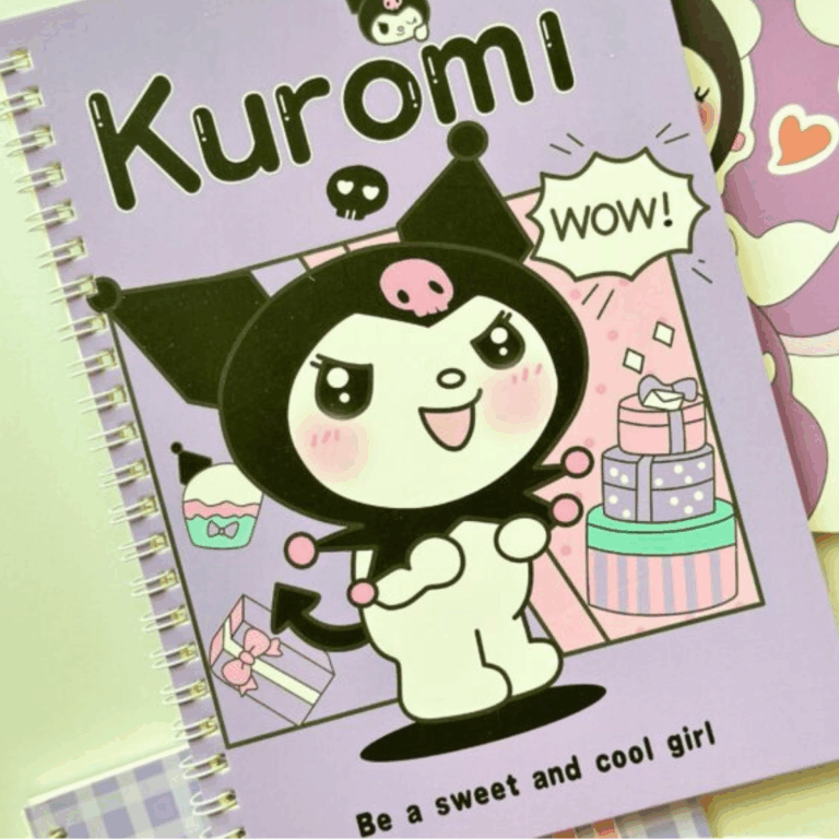 A muted lavender spiral notebook featuring a cheeky illustration of Kuromi looking excited next to a tall, tiered birthday gift box, with a "WOW!" comic-style speech bubble and the text "Be a sweet and cool girl" printed at the bottom