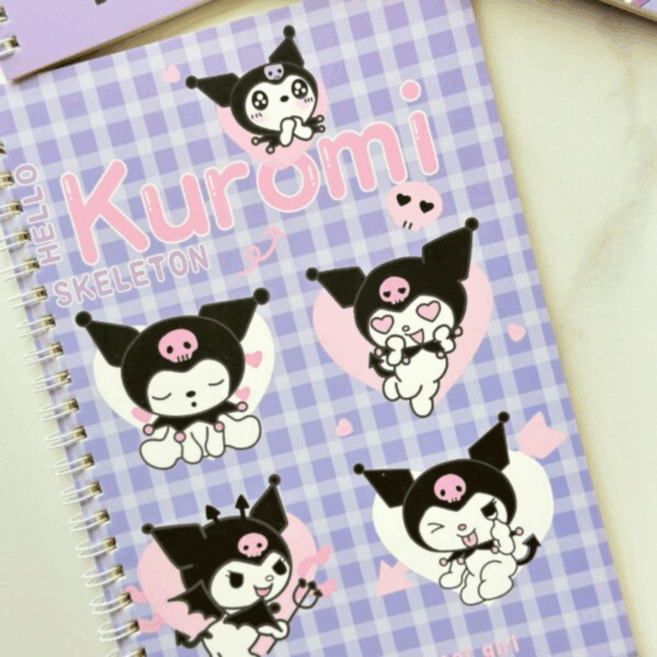 A lavender and white gingham plaid spiral notebook featuring five different illustrations of Kuromi expressing various moods inside soft pink and white hearts, with the words "Hello Skeleton" and "Kuromi" printed across the front