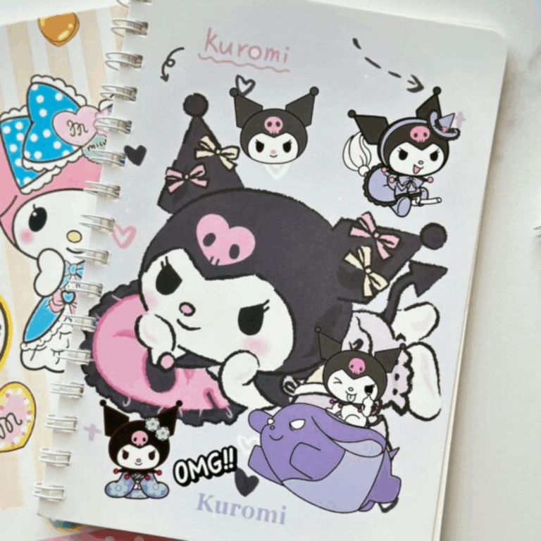 A white spiral notebook decorated with a collage of Kuromi illustrations in various outfits, including a large drawing of her resting on a pink pillow, a witch costume, a traditional kimono, and riding on a purple Baku character