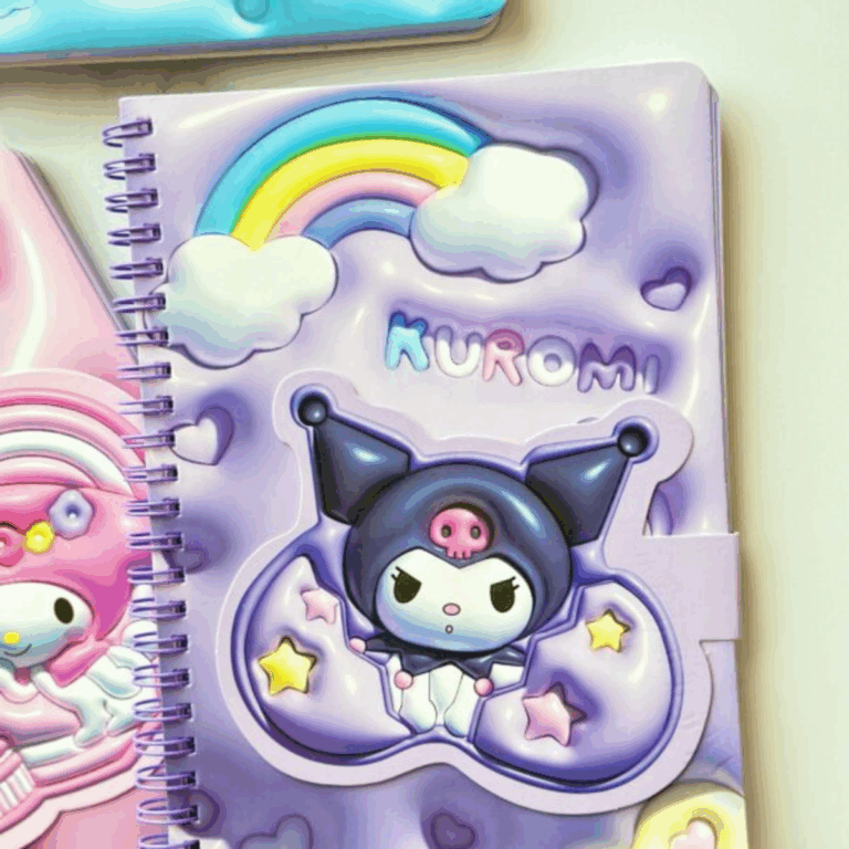A close-up view of a purple spiral notebook with a 3D padded, puffy cover featuring Kuromi sitting inside a crescent cloud among stars, with a colorful rainbow stretching between fluffy white clouds above her name