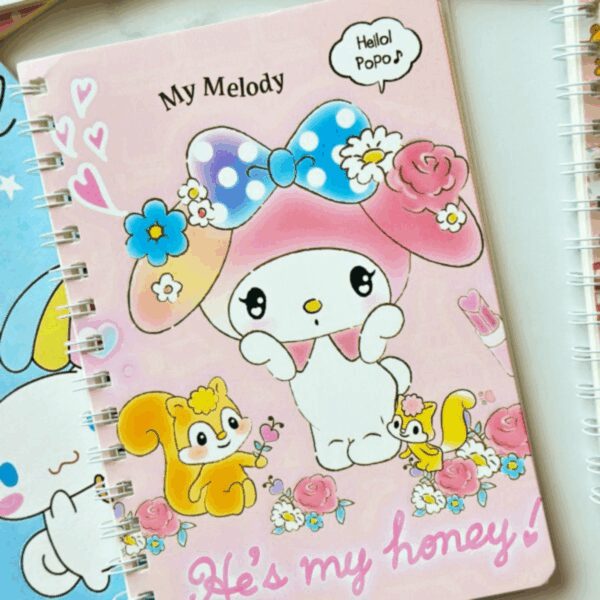 A soft pink spiral notebook featuring a vintage-style My Melody wearing an oversized blue polka-dot bow adorned with colorful daisies and a pink rose, standing next to a cute yellow squirrel character in a garden of flowers